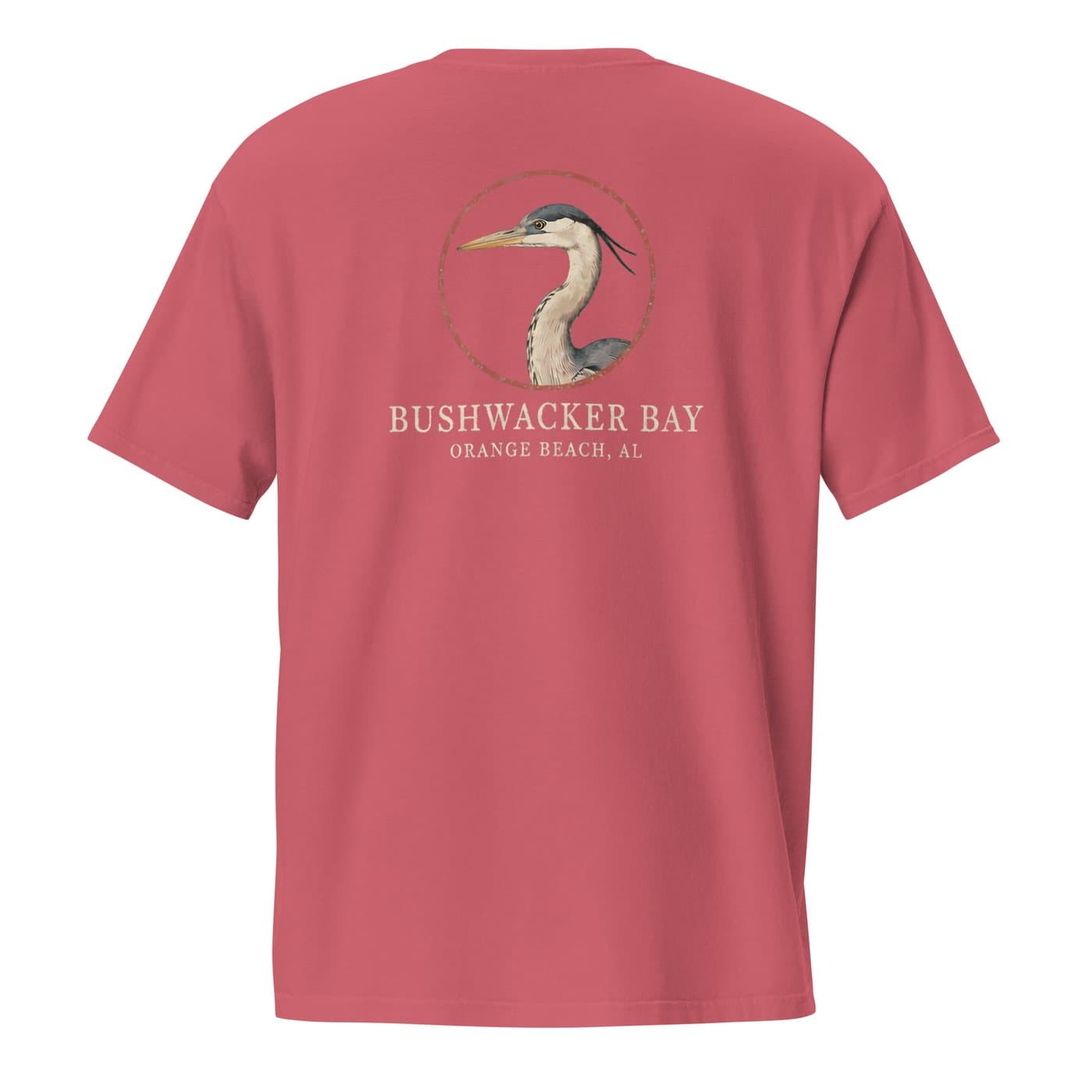 The back of a tee printed with a great blue heron in vintage engraving style inside a distressed red ring, with Bushwacker Bay and Orange Beach, AL lettered beneath